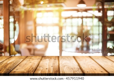 Desk space platform over blurred window resturant or coffee shop background for product display montage