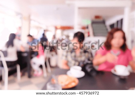 Blur image of  restaurant and people.