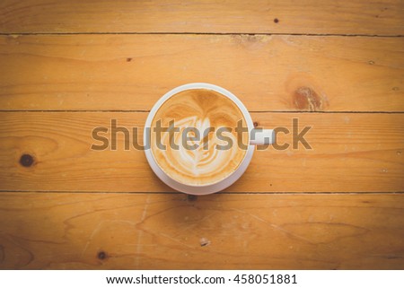 coffee latte art on wood table