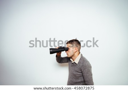 man with binoculars. gray background