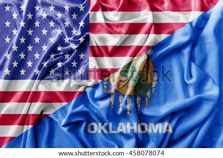 Ruffled waving United States of America and Oklahoma flag