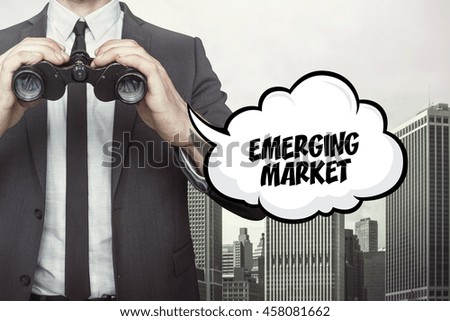 Emerging market text on speech bubble with businessman holding binoculars