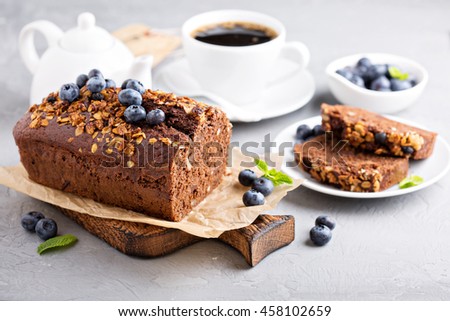 Chocolate whole wheat quick bread with nuts and fresh blueberry Royalty-Free Stock Photo #458102659