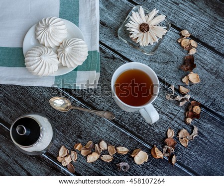 Nice food photo with a cup of tea and meringue
