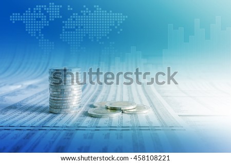 Business concept, coin stacks on news paper with financial graph stat business and world map background.