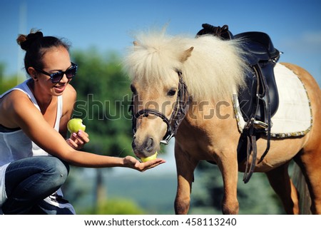 Teen girl with palomino pony