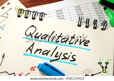 Sign Qualitative Analysis on a notepad and marker. Royalty-Free Stock Photo #458115913