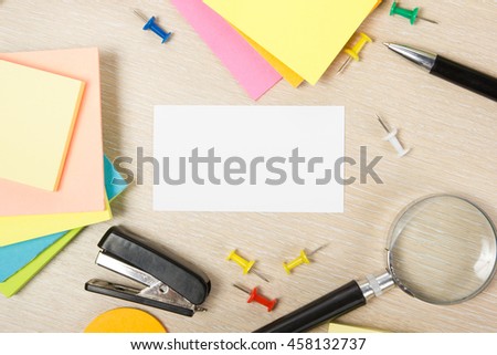 Office table desk with supplies white blank business visit card, gift, ticket, pass, present close up on wooden background. Copy space Blank corporate identity package business card Template for ID. 