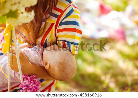 Mother  poses for photographers with her baby