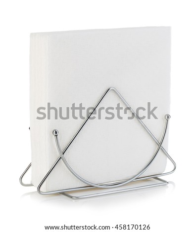 Table napkin holder with napkin close-up isolated on a white background.