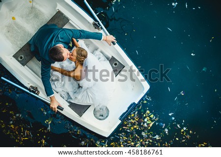 amazing  woman and her man  spend time in the boat Royalty-Free Stock Photo #458186761