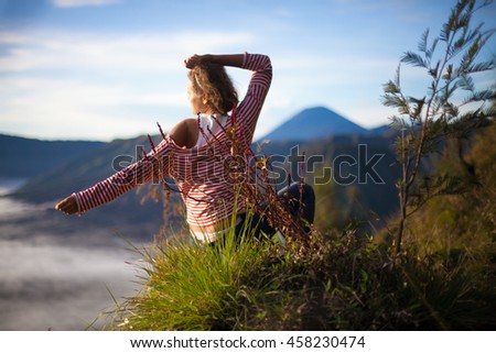 Portrait Young Pretty Girl Sunrise Landscape.Africa Nature Morning Volcano Viewpoint.Woman Engaged Yoga Meditation Mountains Dawn.Mountain Trekking.Horizontal picture.First Rays Rising Sun