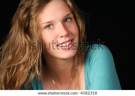 closeup portrait of a beautiful teenager girl smiling