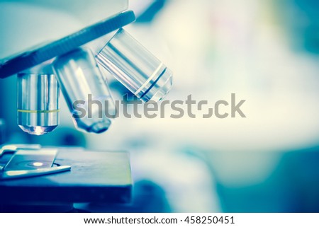 Laboratory Microscope. Scientific research background.white tone. Royalty-Free Stock Photo #458250451