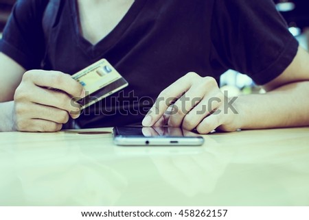 Business Man holding a credit Working With Modern Devices, Digital Mobile Phone(Vintage)