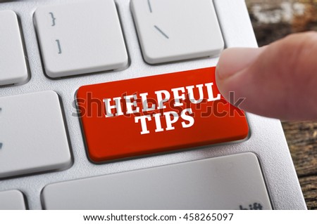 Finger at "HELPFUL TIPS" On Keyboard Button
