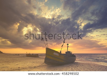fishing boats on the sea beach,sunset ,Vintage retro stylized photo 