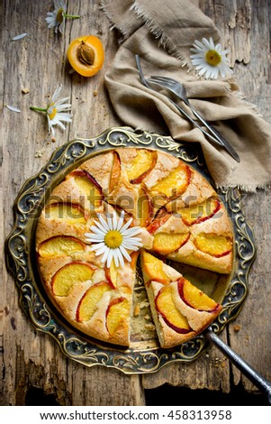 Peach pie on vintage tray top view