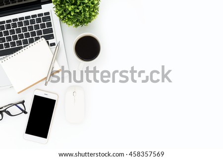 Designer office desk table with laptop with IT gadgets, cup of coffee and supplies. Top view with copy space, flat lay.