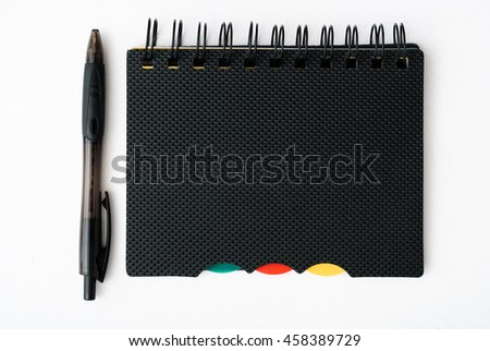 notepad with pen isolated on white background