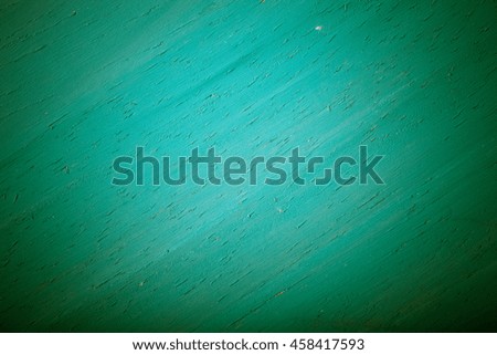 Painted wooden cutting board for background. Toned.