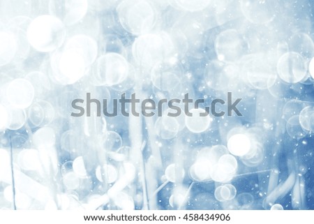 silvery blue highlights snow rain water blurred background