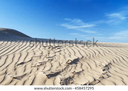 Beautiful photo of sand in the desert against the sky.