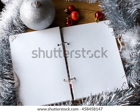 White notepad. Happy new year.New Year's goals with colorful decorations.New Year's goals are resolutions or promises that people make for the New Year to make their upcoming year better in some way