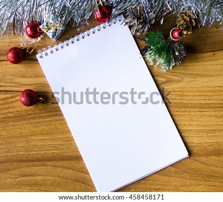 White notepad. Happy new year.New Year's goals with colorful decorations.New Year's goals are resolutions or promises that people make for the New Year to make their upcoming year better in some way