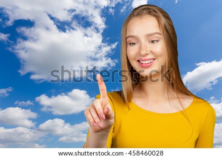 smiling young woman pointing