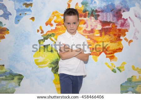 Child, student, boy on the background of the world map