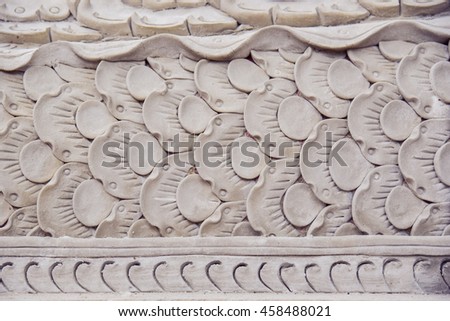beautiful Clay sculpture on temple wall, thailand