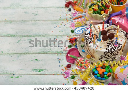 Birthday cake and various accessories for the holiday on a white background