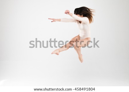 ballerina on a light background, ballerina fulfills movement, ballet pas, ballet pose, beautiful and charming ballerina