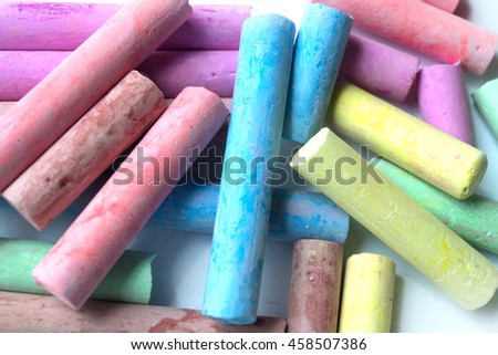 Colored crayons on white background