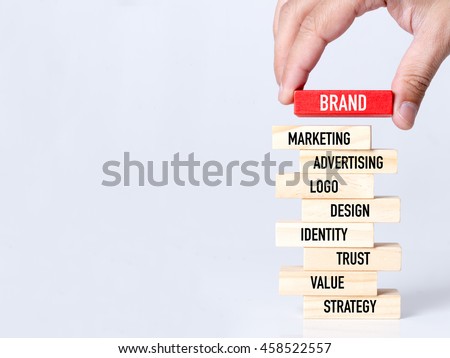 Businessman Building BRAND Concept with Wooden Blocks Royalty-Free Stock Photo #458522557