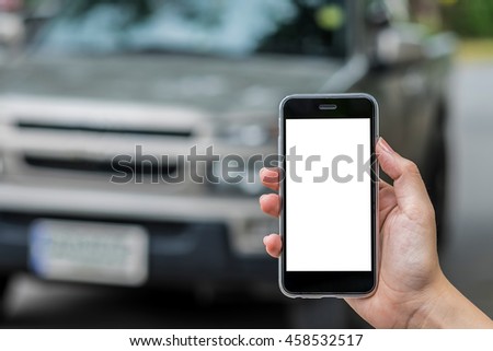 Close up hand holding  smart phone white screen.Smart phone with blank screen and can be add your texts or others on smartphone. background Pickup Gray on road.