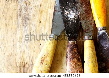 trowel on wood background,technician tool
