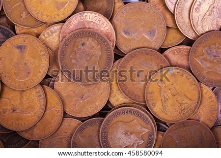 Old penny coins spread out for a background