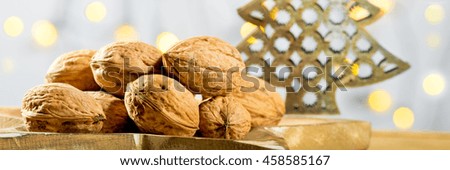 Wallnuts with Christmas tree on the wooden table