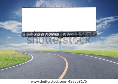 Blank billboard for your advertisement with space for text on road curve,with green grass and blue sky white cloud