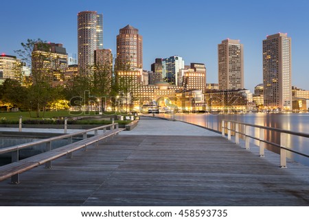 The skyline of Boston in Massachusetts, USA at sunrise with its mix of modern and historic architecture at Boston harbor and Financial District.