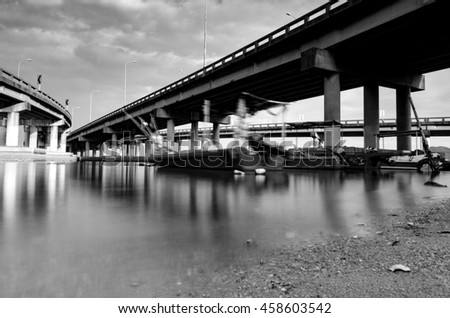 black and white image under penang bridge located in Penang, Malaysia.blurred moving object due to long exposure