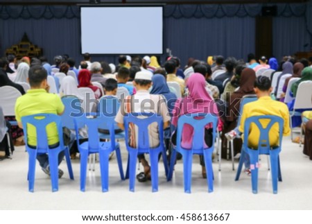 Business  blur blurred abstract education training conference in room seminar meeting,  analyze Statistics Financial Concept with  projector Movie screen.