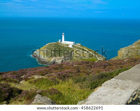 Panoramic view of South Stack Lighthouse and its island with yellow gorse and purple heather