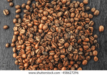 Roasted brown coffee beans, can be used as a background and texture