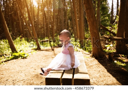 Eleven months old baby girl in forests Royalty-Free Stock Photo #458673379