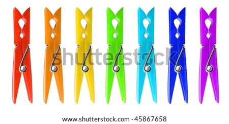 Seven many-colored clothespins isolated on white background.