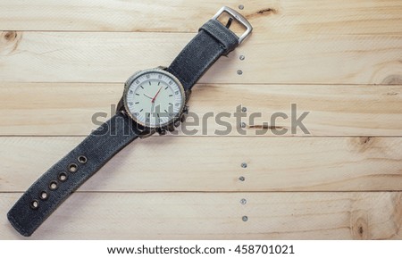 vintage Watch on the wooden background / selective focus,copy space