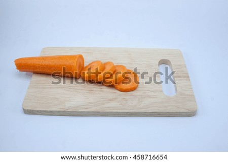 sliced carrots on wood board